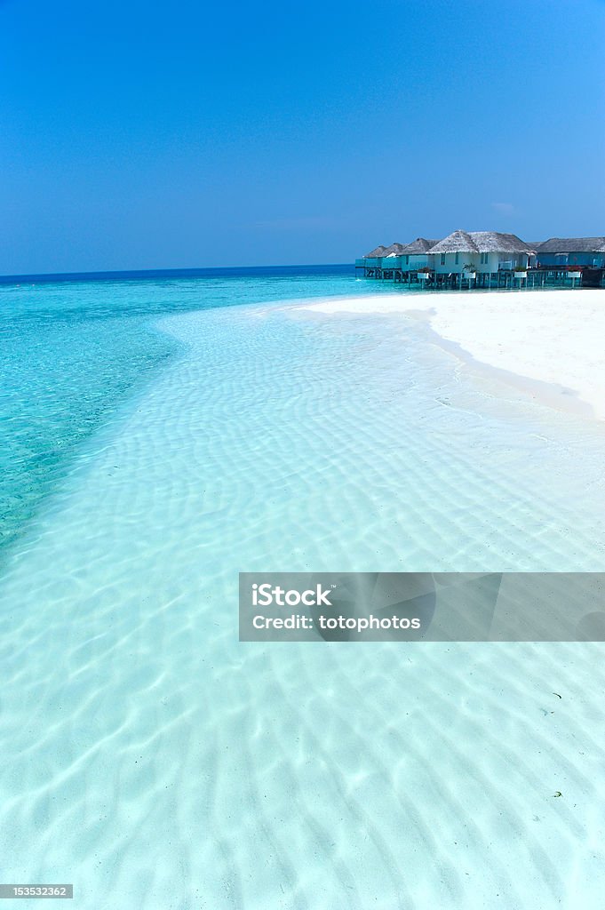 Maldives water villa and white beach Maldives water villa - bungalows and white beach Beach Stock Photo