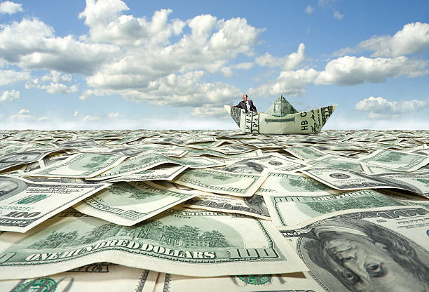 istock Businessman sailing on dollar boat 153532596