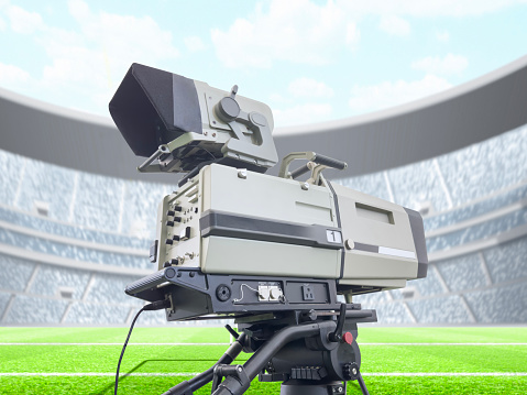 Broadcasting camera on tripod in a sports stadium
