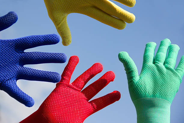 istock on background the sky, hands in colorful gloves 153534335