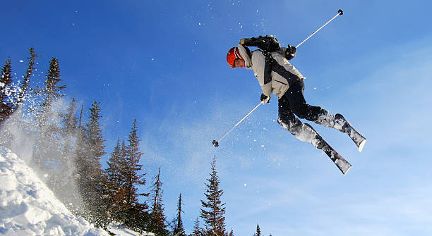 Skier jumping high stock photo