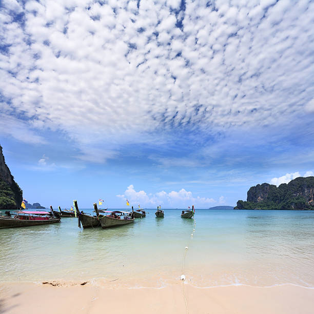 istock Light cirrus clouds over the warm sea 153535670