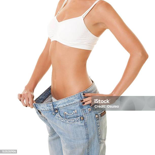 Woman Shows Her Weight Loss Stock Photo - Download Image Now - Abdomen, Adult, Beautiful People