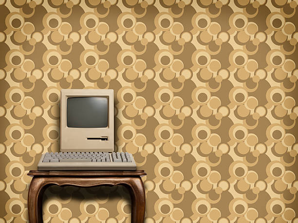 istock Retro computer on wooden table with sixties wallpaper 153536272