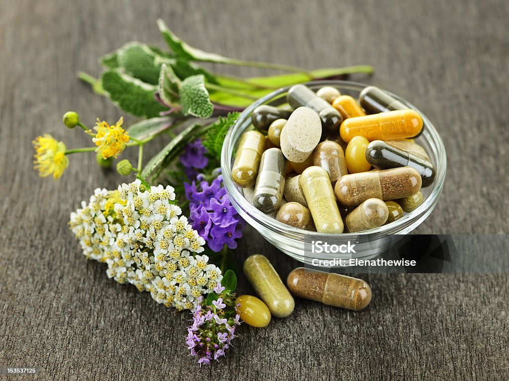 Herbal medicine and herbs Herbs with alternative medicine herbal supplements and pills Herbal Medicine Stock Photo
