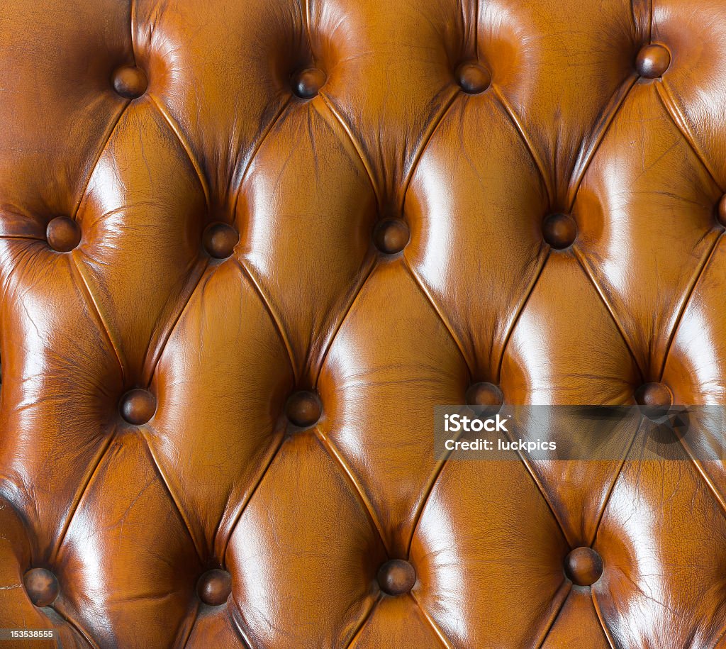 texture Primo piano di divano in pelle marrone vintage - Foto stock royalty-free di Ambientazione interna