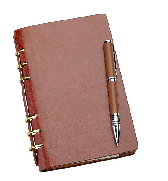 istock Notebook in a brown leather cover and stylish pen 153540485