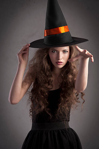 istock pretty girl wearing a huge witch hat 153542831