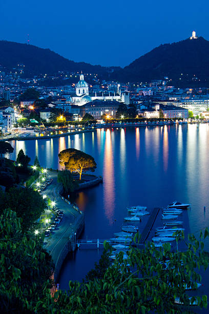 комо city scape - lake como water italy sunset стоковые фото и изображения