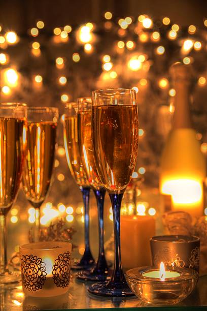 istock Champagne in glasses,candles and twinkle lights. 153548646