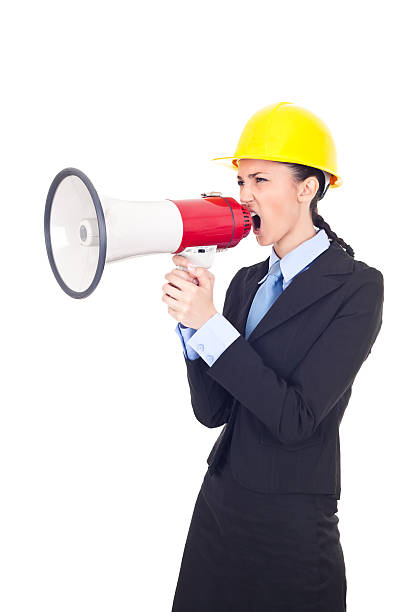 istock megaphone businesswoman with hardhat shouting 153549200
