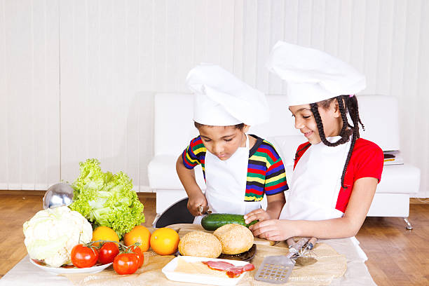 istock Boy and girl cooking 153550038
