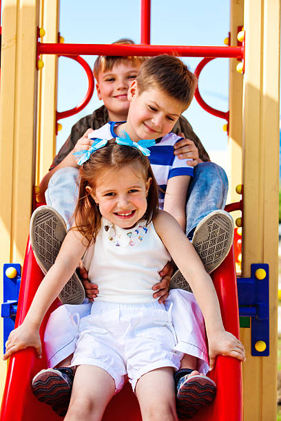 istock Friends on the playground slide 153550250