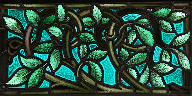 Stained Glass leaves A vivid panel of lush leaves with twining stems in a stained glass window. From St. Paul's Church (1749), Halifax, Nova Scotia. stained glass photos stock pictures, royalty-free photos & images