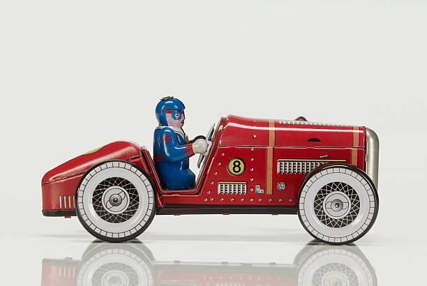 Racecar tin toy  in white stock photo