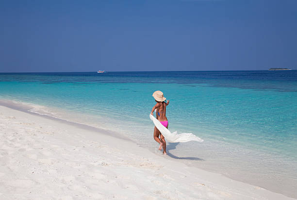 istock Happy woman on the beach 153551168