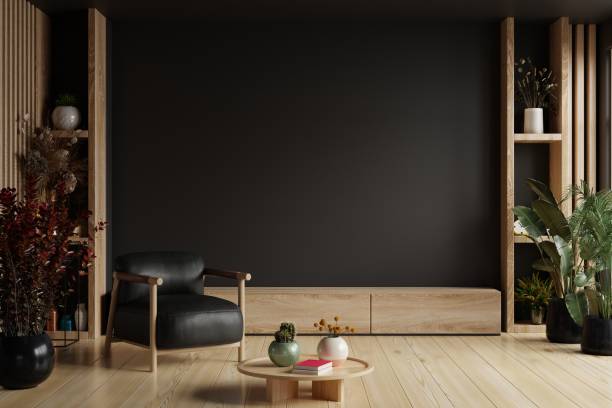 istock TV room interior with black leather armchair on empty dark wall background. 1535512303