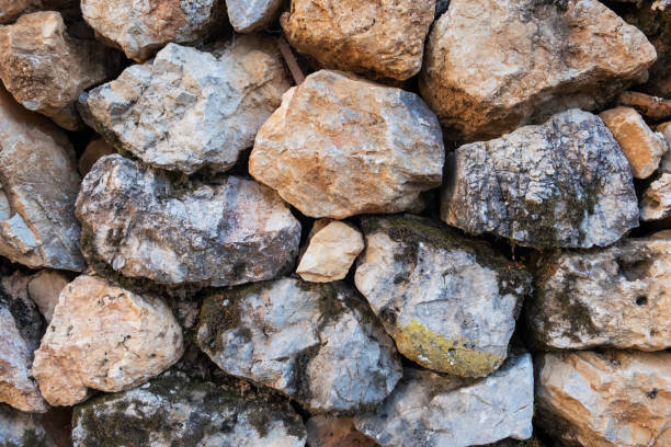 istock Texture of a stone wall. Old castle stone wall texture background. 1535515335