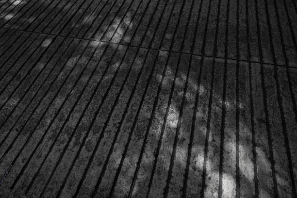 A close-up of light shining on a concrete road