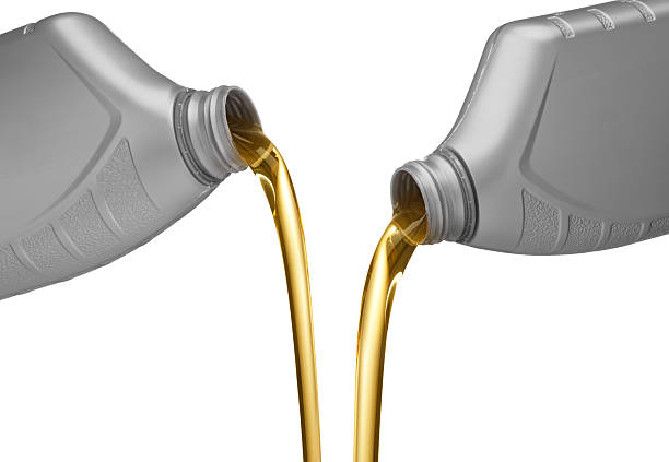istock Two gray bottles pouring motor oil 153552025