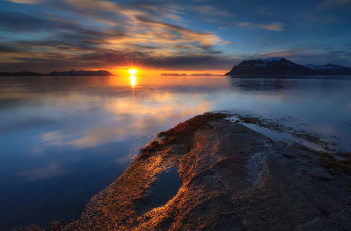 On june 1st 2011 there was a partial solar eclipse around midnight in Northern Norway. This is a shot from that session. Stunning light over VÃ¥gsfjorden in Troms.