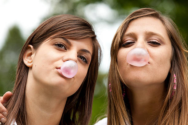 istock Two teen blow a bubble gum 153552538