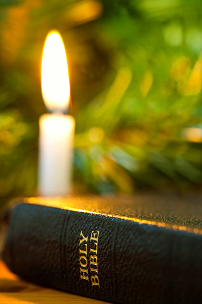 istock Bible and Christmas Candle 153552962