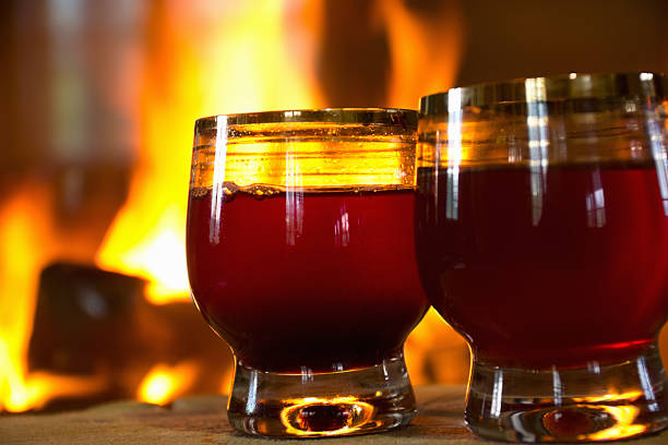 istock glasses of wine by the fireplace 153553358