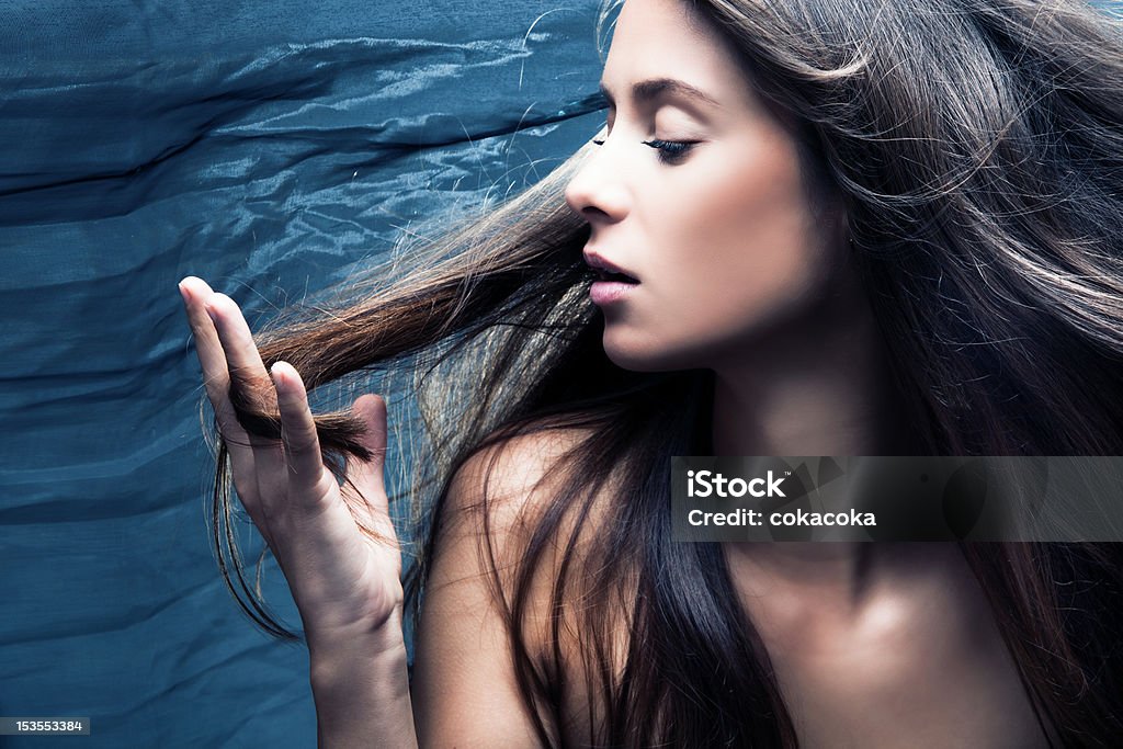 hair sensual woman portrait, long hair in motion, profile, studio shot Adult Stock Photo