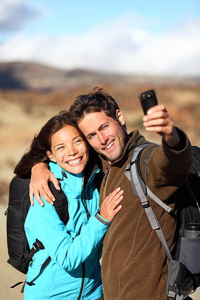 istock Happy young couple outdoors hiking 153554182