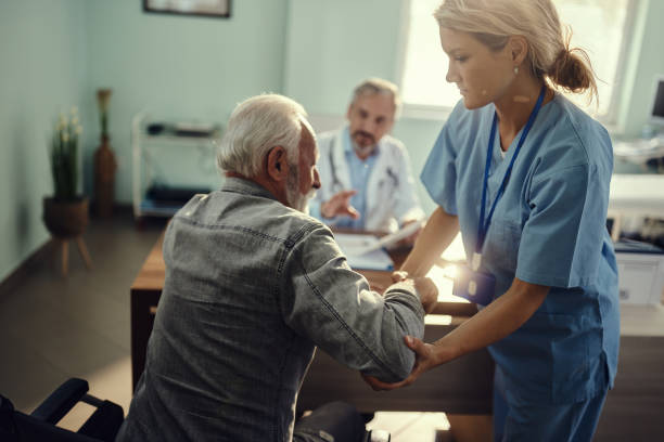 istock Assisting disabled patient in hospital! 1535553854