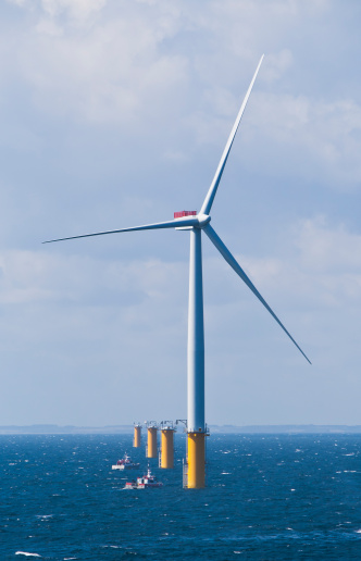 Single Offshore Wind Turbine in a Windfarm under construction  off the English Coast