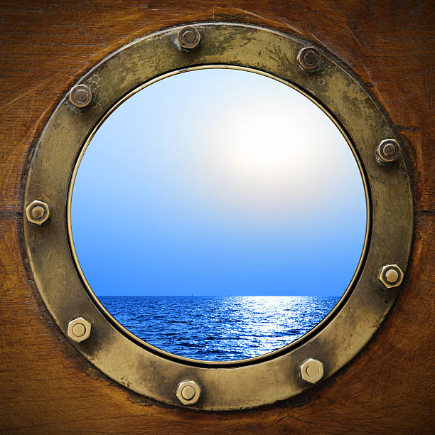 istock Boat porthole looking at ocean and sky 153557056