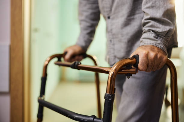 istock Close up of unrecognizable man using walker in hospital. 1535572123