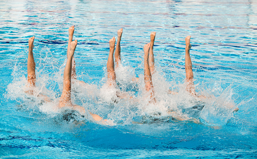 Synchronized swimmers legs movement.