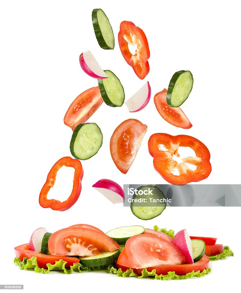 vegetables the cut fall on  lying a heap cucumber, tomato,pepper, garden radish of fall on vegetables lying a heap on a white background Breast Lobule Stock Photo
