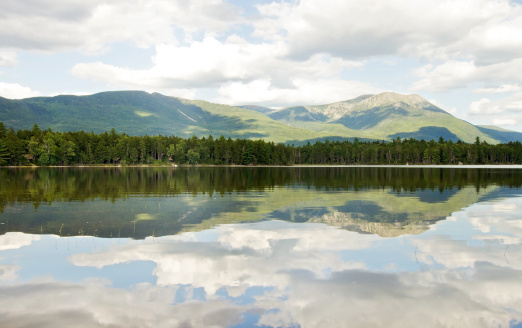 Mount  Katahdin in Baxter State Park, Maine. Lake reflection on a cloudy summer day.