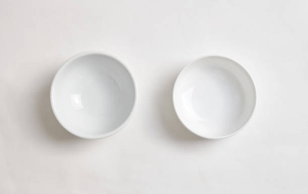 istock empty white bowl isolated on white background. Top view. 1535599386