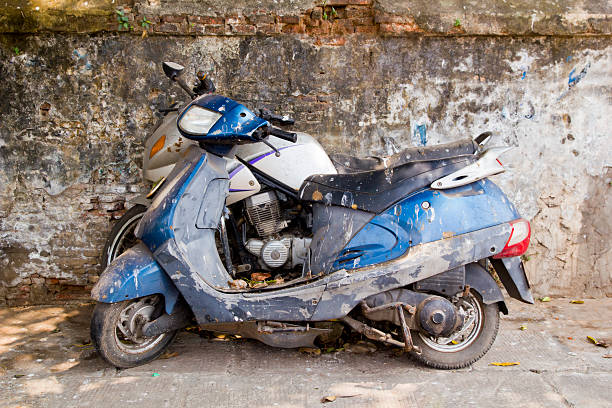 Abandoned old dirty motorcycles on street stock photo