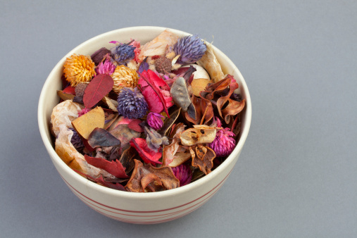 Various plants of a potpourri in a ceramic round bowl.