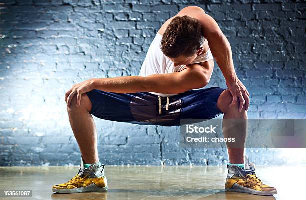Young Man Sports Exercises Stock Photo - Download Image Now - 20-29 Years, Activity, Adult