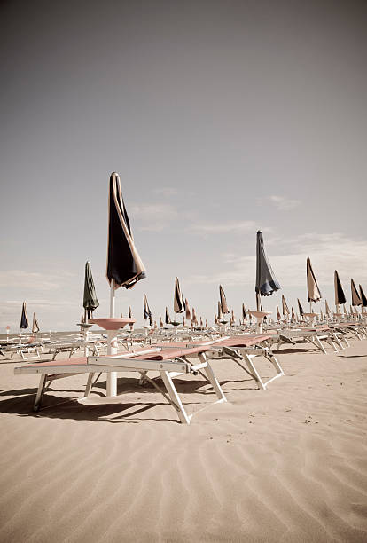 Desert Lido with Lawn Chairs and Closed Umbrellas stock photo