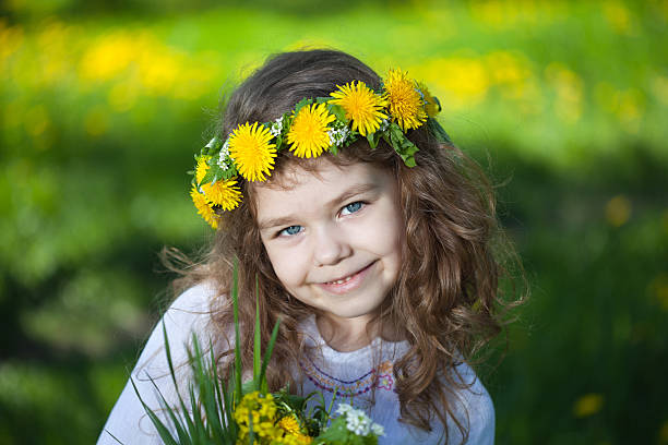 istock Little girl with dandelions 153561498