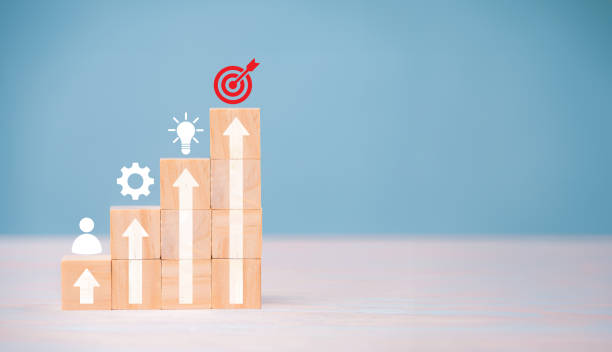 istock Successful Business Teamwork, Empowering Employees for New Projects and Leadership Success in Corporate Settings. wooden block with icon in goal and success concept. 1535629192