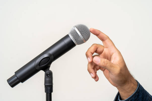 istock Knock knock Close up finger testing microphone voice. Before speaking or singing. 1535631781
