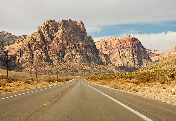 istock Road Toward Mountains in Desert 153564832