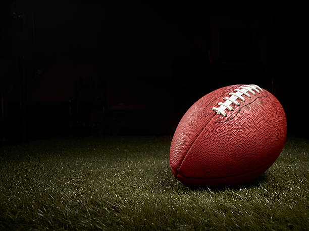 istock football on a grass field 153565017