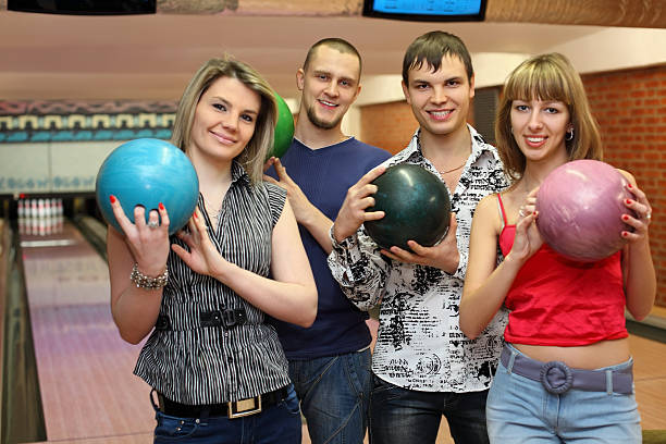 istock Two in lovers couple stand with balls for bowling 153565070