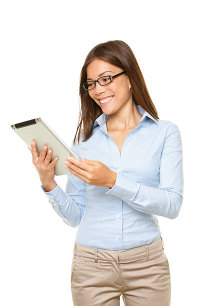istock Young woman smiling at tablet pc 153565298