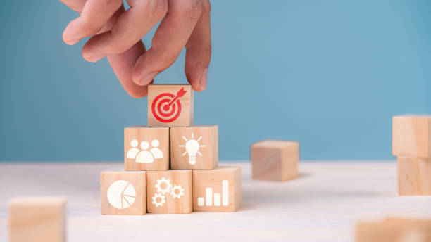 istock Successful Business Teamwork, Empowering Employees for New Projects and Leadership Success in Corporate Settings. wooden block with icon in goal and success concept. 1535654671